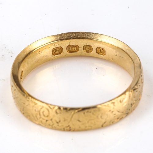 163 - A heavy Victorian 18ct gold wedding band ring, engraved foliate decoration, maker's marks GB, hallma... 