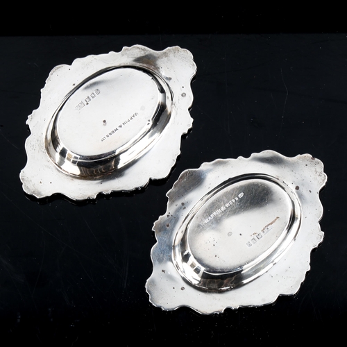 186 - MAPPIN & WEBB - a pair of George V cast-silver pin dishes, with cast floral and foliate rims, hallma... 