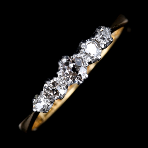 195 - An 18ct gold graduated 5-stone diamond ring, platinum tops with old-cut diamonds, total diamond cont... 