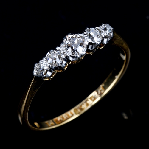 195 - An 18ct gold graduated 5-stone diamond ring, platinum tops with old-cut diamonds, total diamond cont... 