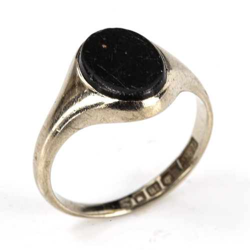 196 - An early 20th century 18ct white gold black onyx signet ring, maker's marks G and C, hallmarks Londo... 