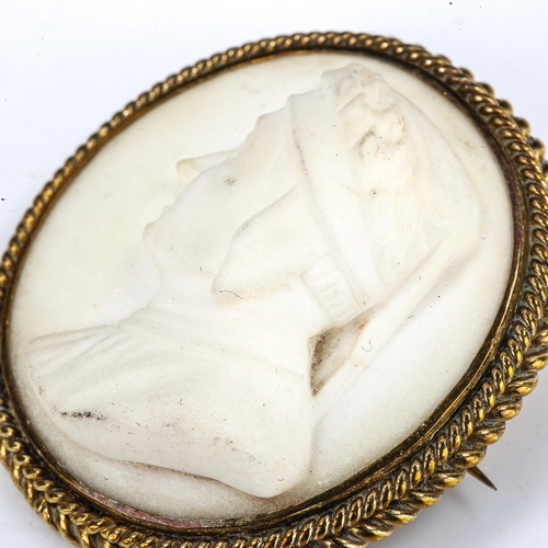 198 - A 19th century relief carved alabaster cameo brooch, depicting profile of Dante, in brass rope twist... 