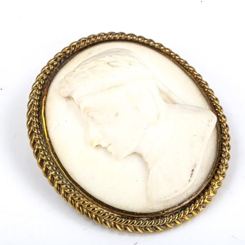 198 - A 19th century relief carved alabaster cameo brooch, depicting profile of Dante, in brass rope twist... 