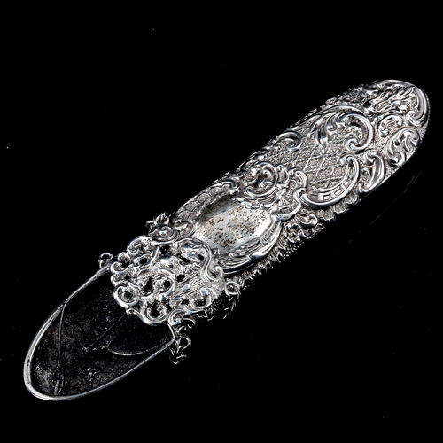 211 - A late Victorian silver spectacles case, with belt clip, relief embossed foliate decoration, indisti... 