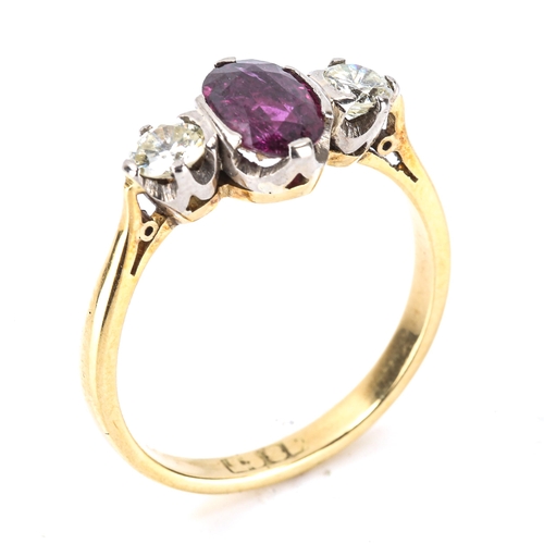 224 - An 18ct gold 3-stone ruby and diamond ring, set with oval mixed-cut ruby and modern round brilliant-... 