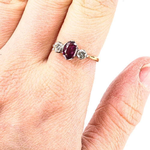 224 - An 18ct gold 3-stone ruby and diamond ring, set with oval mixed-cut ruby and modern round brilliant-... 