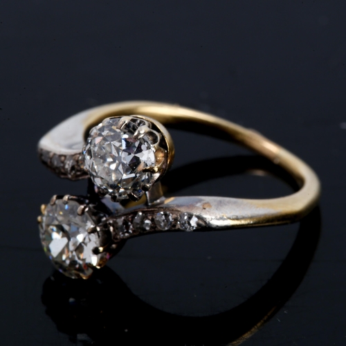 226 - An Antique diamond crossover ring, unmarked gold settings with old European-cut principal diamonds a... 