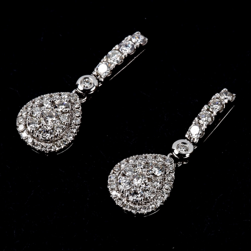 228 - A pair of modern 18ct white gold diamond cluster pear-drop stud earrings, set with modern round bril... 