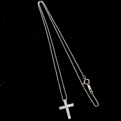 271 - A small modern 18ct white gold diamond cross pendant necklace, claw set with modern round brilliant-... 