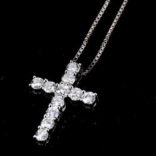 271 - A small modern 18ct white gold diamond cross pendant necklace, claw set with modern round brilliant-... 