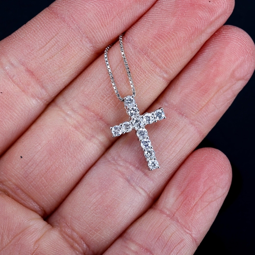 271 - A small modern 18ct white gold diamond cross pendant necklace, claw set with modern round brilliant-... 