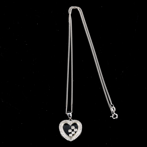 273 - A modern 18ct white gold diamond heart pendant necklace, with floating modern round brilliant-cut di... 