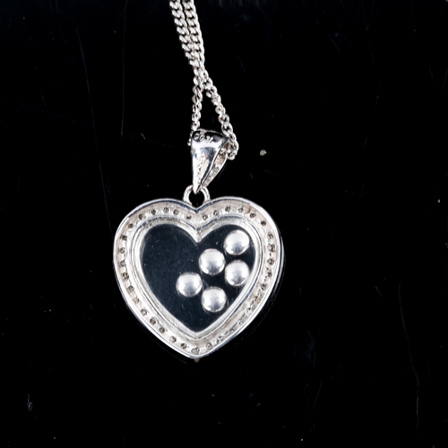 273 - A modern 18ct white gold diamond heart pendant necklace, with floating modern round brilliant-cut di... 