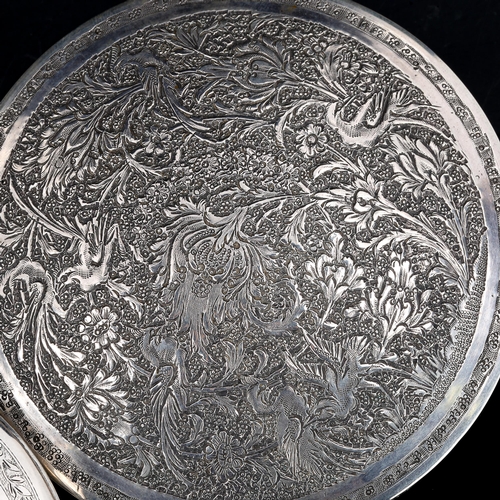 311 - 2 Persian silver circular boxes, allover engraved decoration, largest diameter 10cm, 9.6oz total (2)