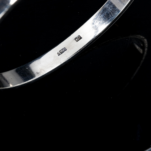 313 - A Danish stylised sterling silver neck torque and similar sterling bangle, maker's include Horsens S... 