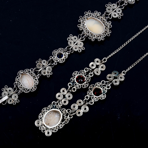 316 - A matching filigree cameo necklace and bracelet set, unmarked settings with relief carved shell pane... 