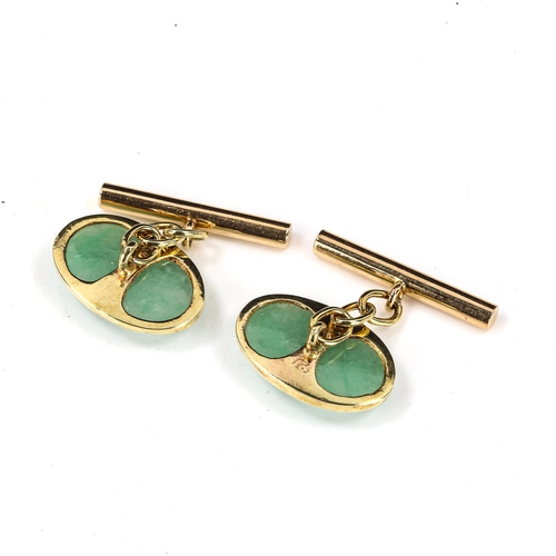 330 - A pair of Chinese 18ct gold jade oval panel cufflinks, panel length 19.1mm, 6.8g