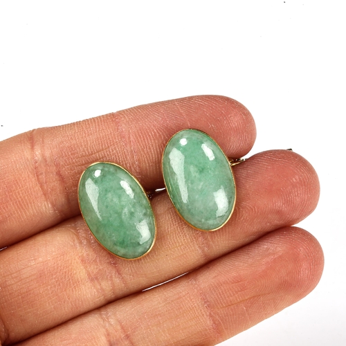 330 - A pair of Chinese 18ct gold jade oval panel cufflinks, panel length 19.1mm, 6.8g