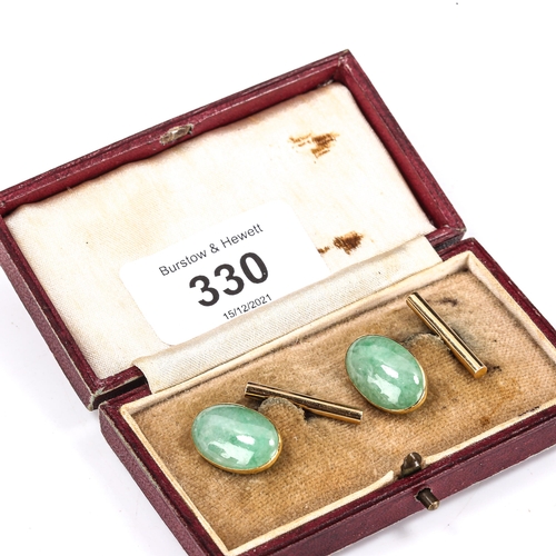 330 - A pair of Chinese 18ct gold jade oval panel cufflinks, panel length 19.1mm, 6.8g