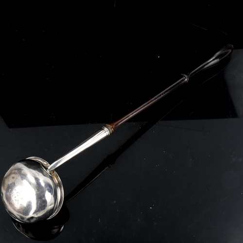 336 - A George II silver toddy ladle, with turned ebony handle and owner's initials on base, by Ralph Maid... 