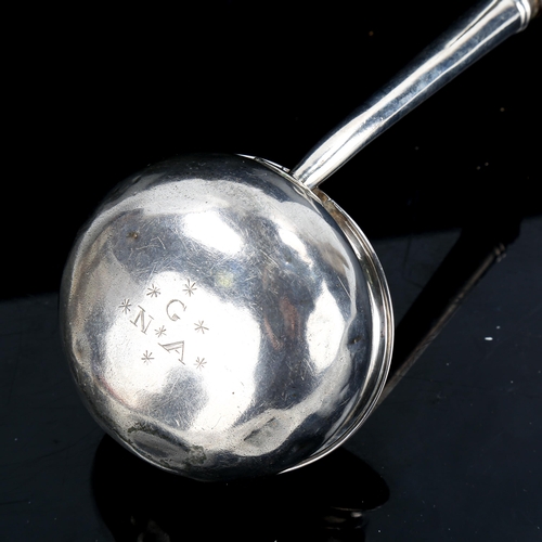 336 - A George II silver toddy ladle, with turned ebony handle and owner's initials on base, by Ralph Maid... 