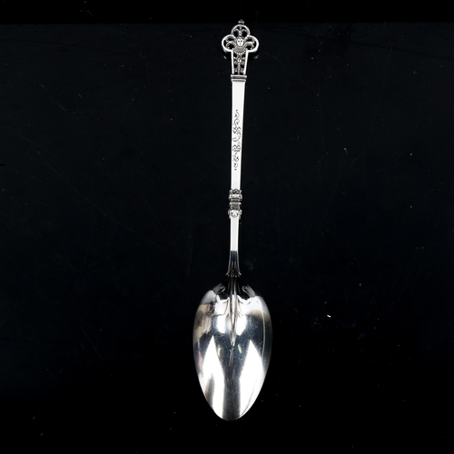 362 - An ornate French silver spoon, pierced decoration with fleur de lis bowl back and gilded bowl, by Ma... 