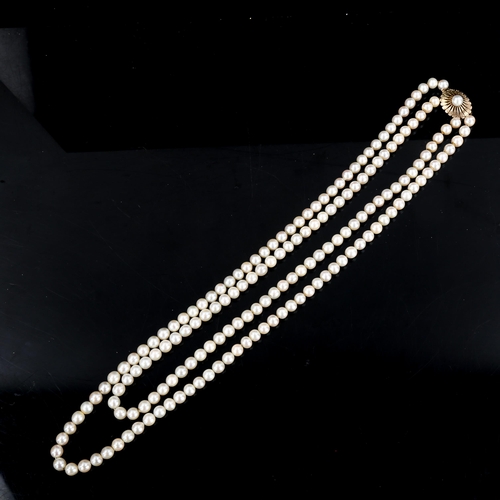 370 - A Vintage double-strand pearl necklace, with textured 9ct clasp, necklace length 56cm, 77.5g