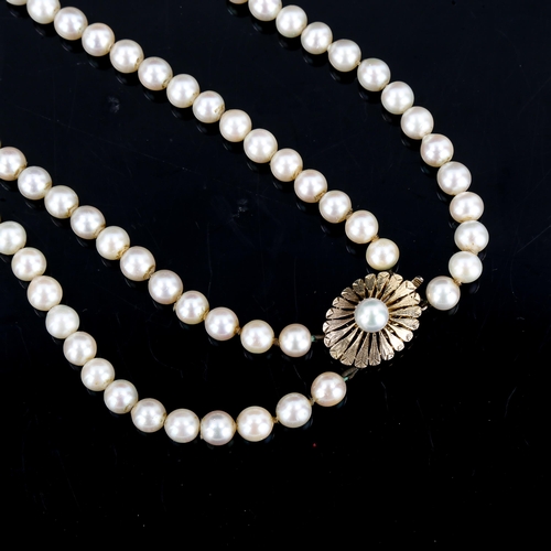 370 - A Vintage double-strand pearl necklace, with textured 9ct clasp, necklace length 56cm, 77.5g