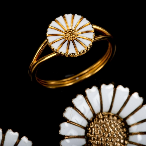 385 - BERNHARD HERTZ - a Danish vermeil sterling silver and white enamel daisy pattern demi-parure, compri... 