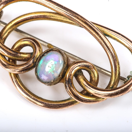 386 - An Art Nouveau opal openwork brooch, unmarked yellow metal settings with oval cabochon white opal, b... 