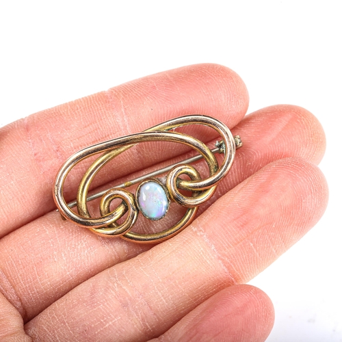 386 - An Art Nouveau opal openwork brooch, unmarked yellow metal settings with oval cabochon white opal, b... 