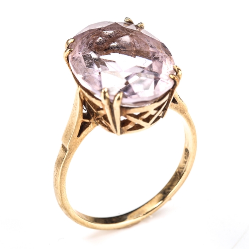 387 - A late 20th century 9ct gold pink stone dress ring, set with oval mixed-cut stone, length 16.1mm, si... 