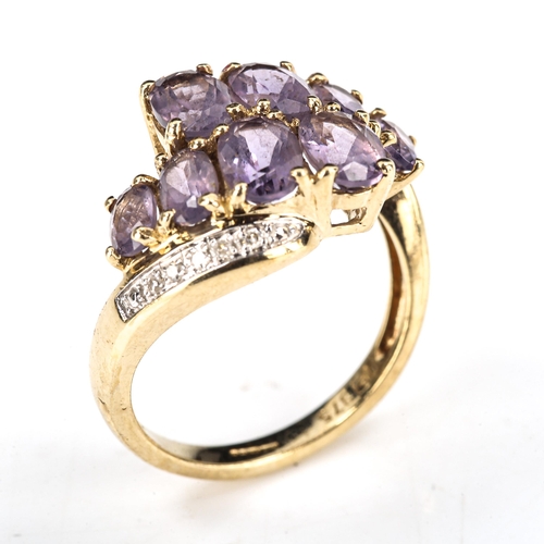 388 - A modern 9ct gold amethyst and diamond crossover ring, set with oval mixed-cut amethyst and single-c... 