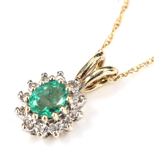 392 - A modern 9ct gold emerald and diamond oval cluster pendant necklace, set with oval mixed-cut emerald... 