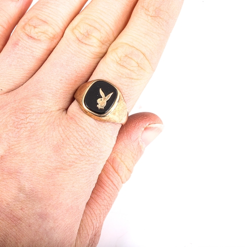 404 - A late 20th century 9ct gold black onyx Playboy bunny signet ring, hallmarks London 1986, setting he... 