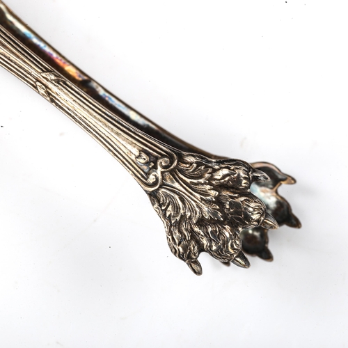 411 - A pair of 19th century French silver-gilt lion paw sugar tongs, length 13.5cm