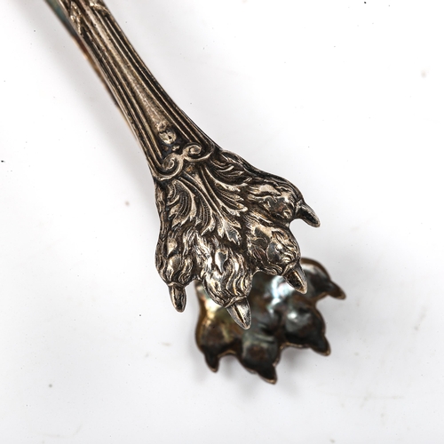 411 - A pair of 19th century French silver-gilt lion paw sugar tongs, length 13.5cm