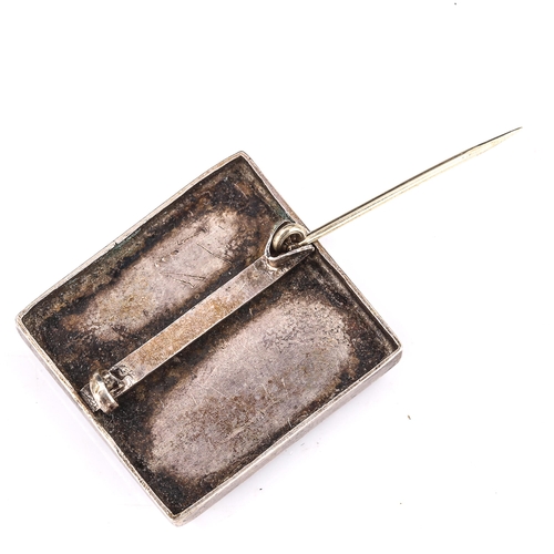 413 - An Arts and Crafts unmarked silver gem set square panel brooch, set with cabochon gem stones, brooch... 