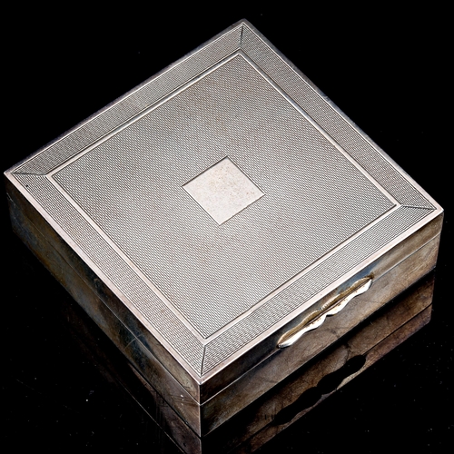 416 - A George VI square silver cigarette box, engine turned lid, by Alexander Clark & Co Ltd, hallmarks B... 