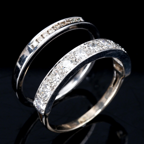 423 - A diamond half eternity ring, unmarked white metal settings with modern round brilliant-cut diamonds... 