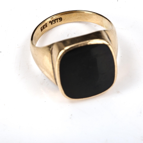 450 - A large Scandinavian 14ct gold black onyx signet ring, maker's marks GIFA, setting height 18.5mm, si... 