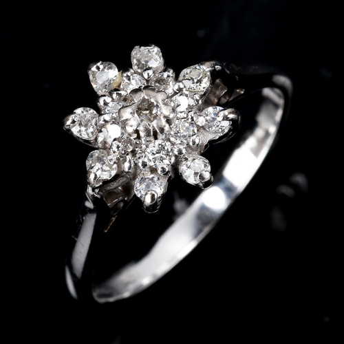 459 - A modern 18ct white gold diamond cluster snowflake dress ring, set with old and single-cut diamonds,... 