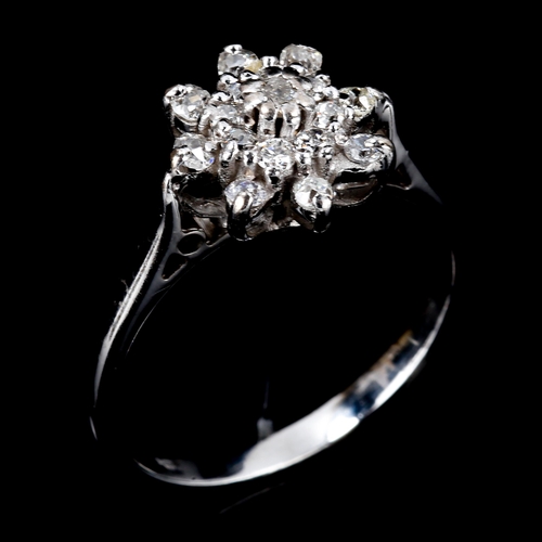 459 - A modern 18ct white gold diamond cluster snowflake dress ring, set with old and single-cut diamonds,... 