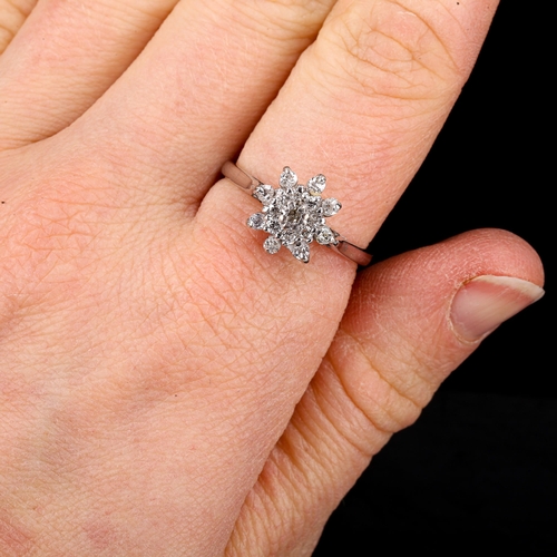 459 - A modern 18ct white gold diamond cluster snowflake dress ring, set with old and single-cut diamonds,... 