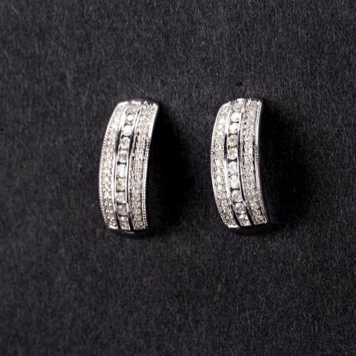 466 - A pair of modern 9ct white gold diamond half hoop stud earrings, set with modern round brilliant-cut... 