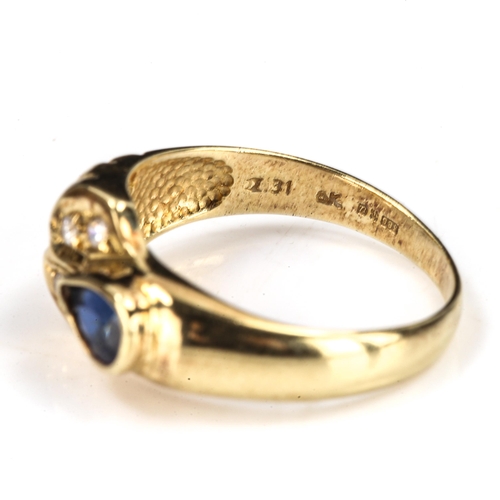 477 - A modern 14ct gold sapphire and cubic zirconia dress ring, setting height 8.4mm, size N, 3g