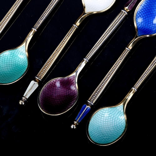 485 - ANTON MICHELSEN - a set of 7 Danish vermeil sterling silver and harlequin enamel coffee spoons, leng... 