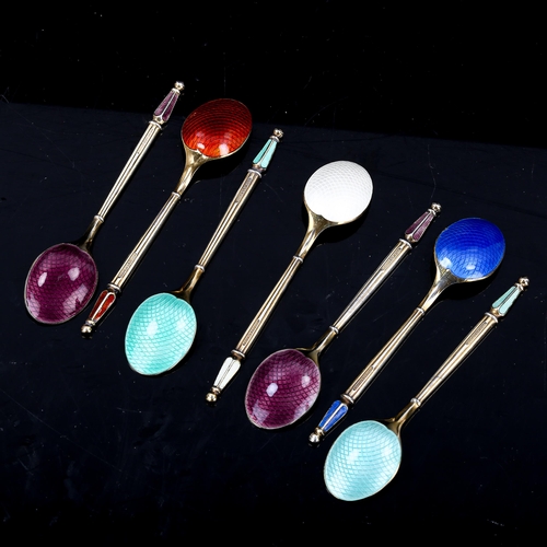 485 - ANTON MICHELSEN - a set of 7 Danish vermeil sterling silver and harlequin enamel coffee spoons, leng... 