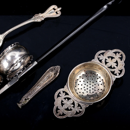 488 - Various silver, including tea strainer, Georgian toddy ladle, teaspoon etc, 2.4oz weighable