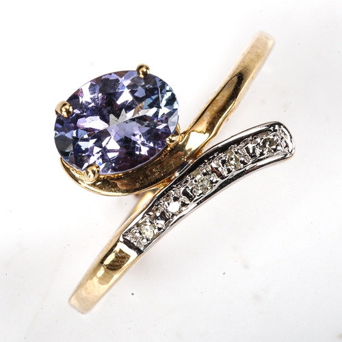 502 - A modern 9ct gold tanzanite and diamond crossover ring, setting height 13.1mm, size N, 2.2g